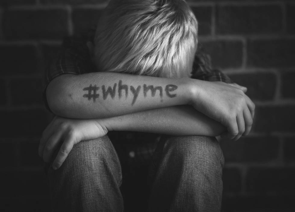 boy-with-hashtag-why-me-written-his-arm.jpg