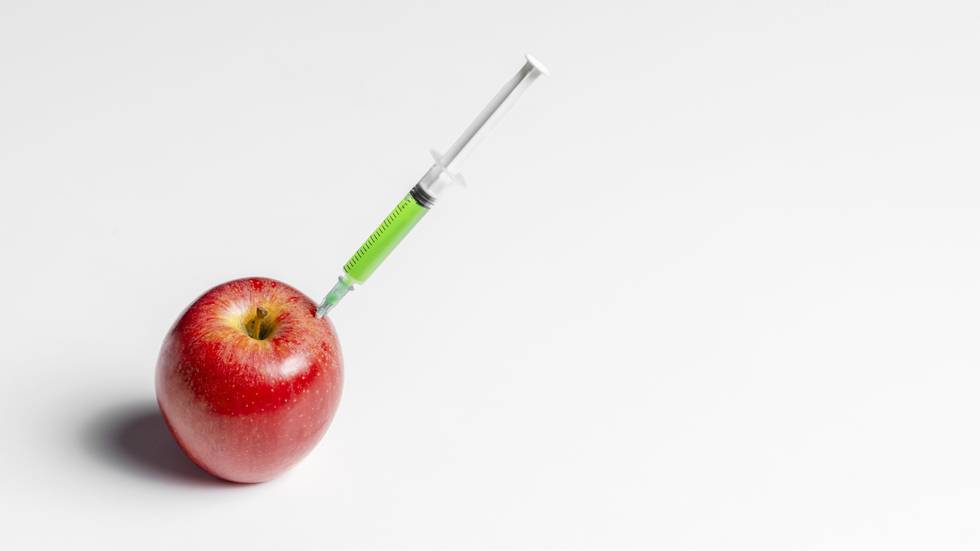 injecting-red-apple-with-green-chemicals.jpg